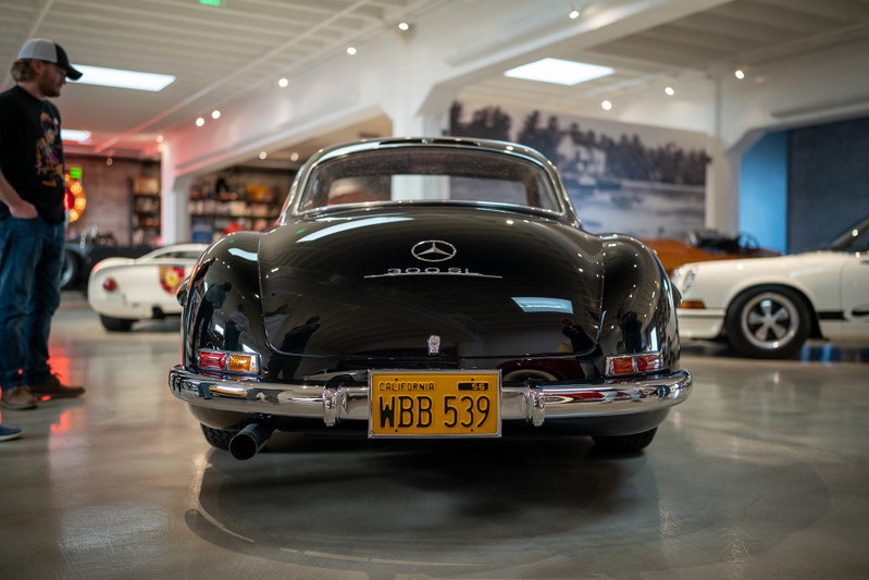 Black 1950s Mercedes-Benz 300SL Gullwing Coupe with California plates.