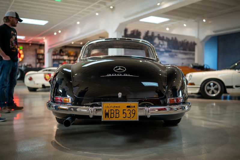 Black 1950s Mercedes-Benz 300SL Gullwing Coupe with California plates.