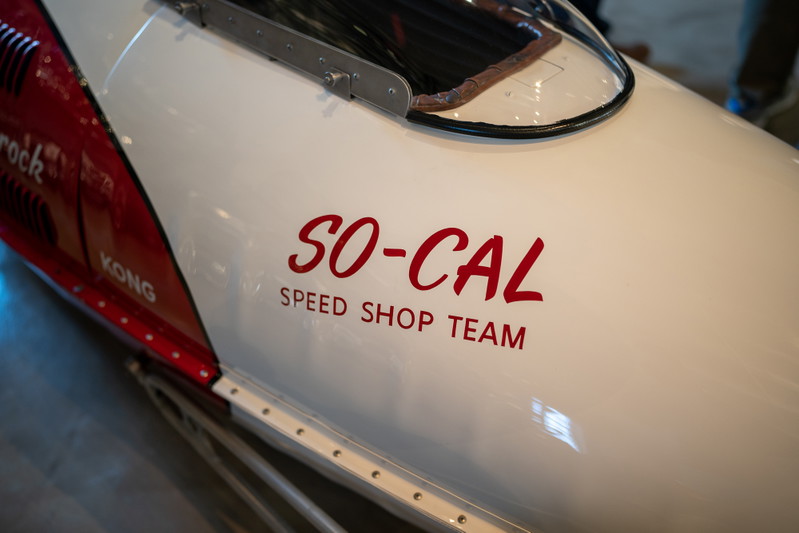 Close-up of a white & red So-Cal Speed Shop Team vintage race car's livery.