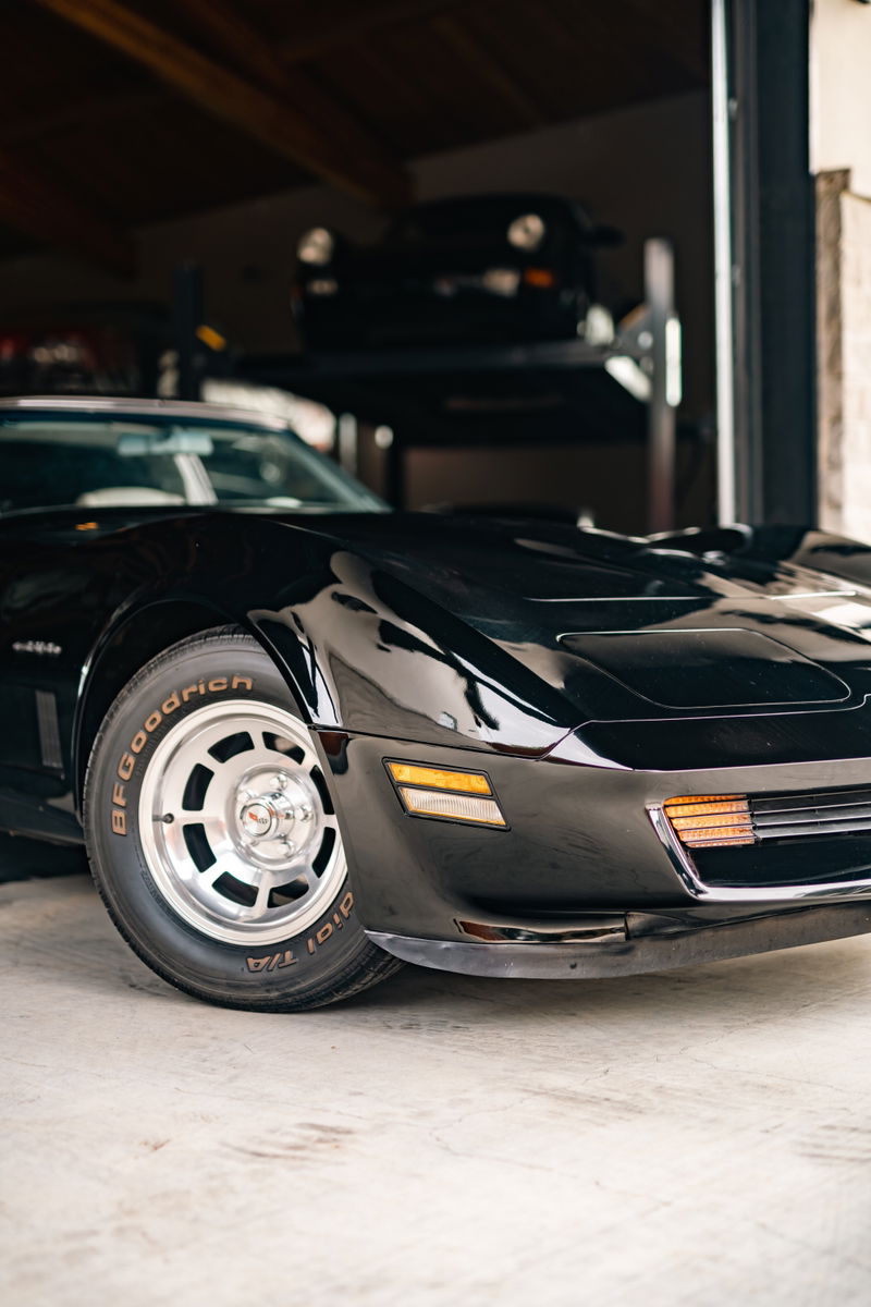 A black 1982 Chevrolet Corvette Stingray with polished alloy rims and BFGoodrich tires.