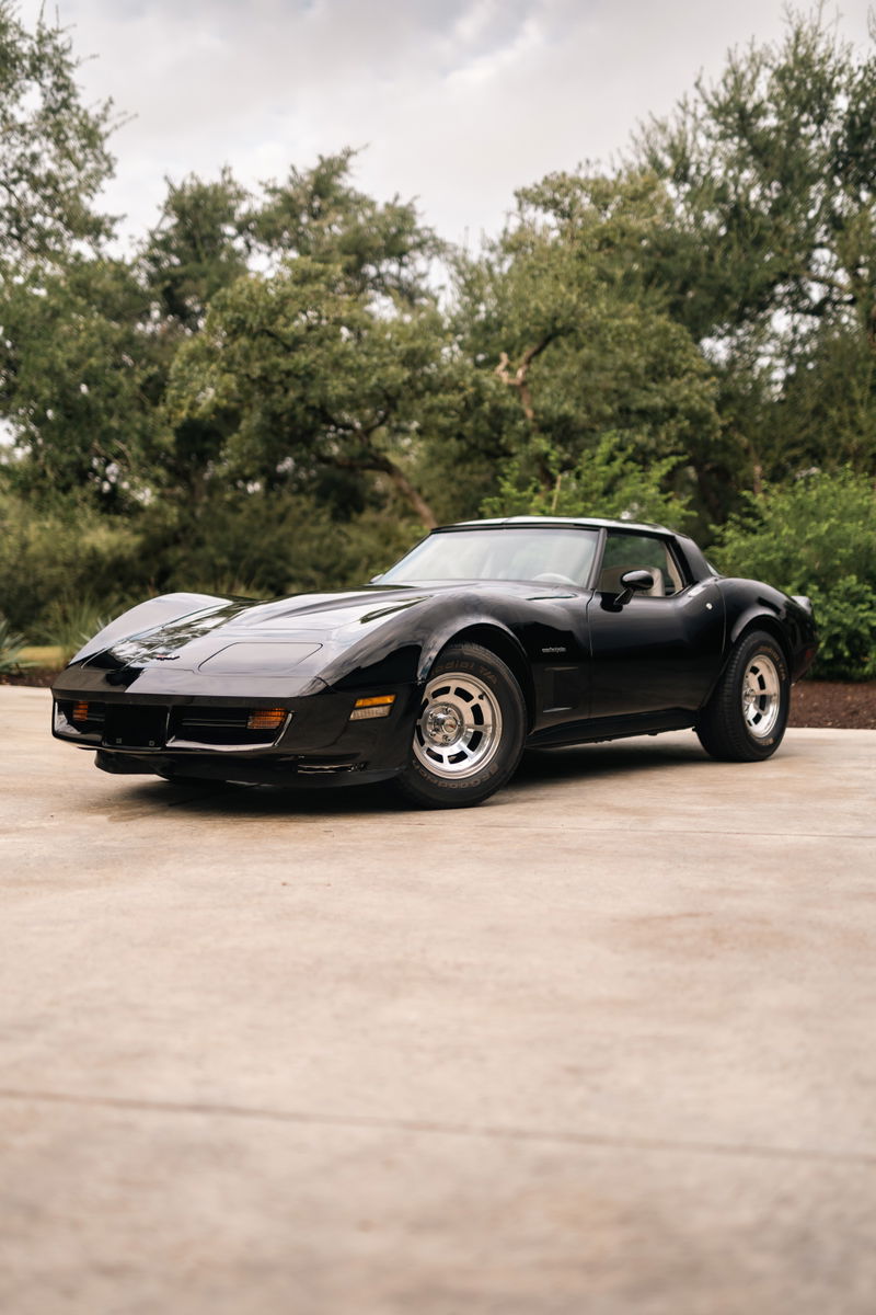 Black 1982 Chevrolet Corvette Stingray with aluminum alloy rims.