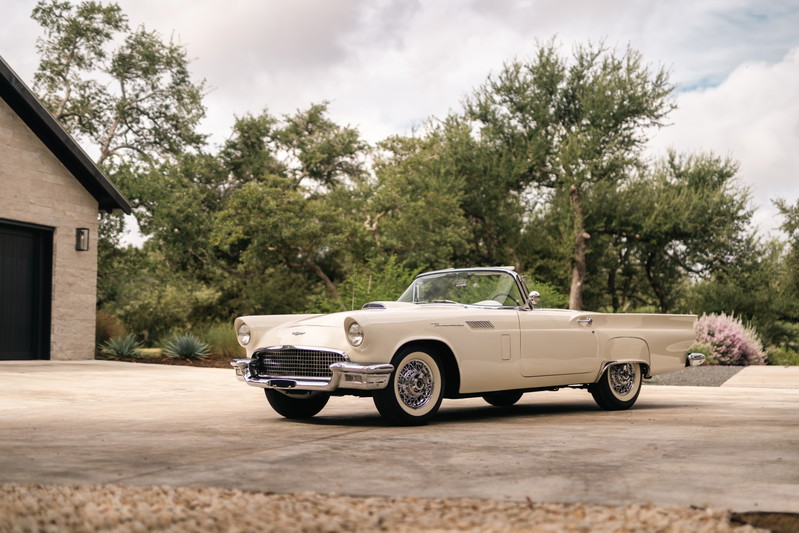 1957 Ford Thunderbird convertible, colonial white paint, chrome trim, wire-spoke rims.