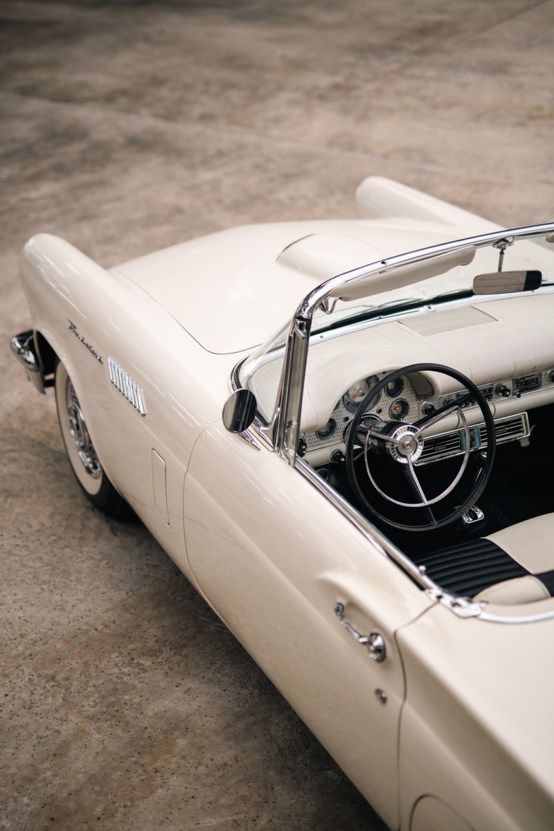 1957 Ford Thunderbird convertible in Colonial White. Close-up on interior and side body panel.