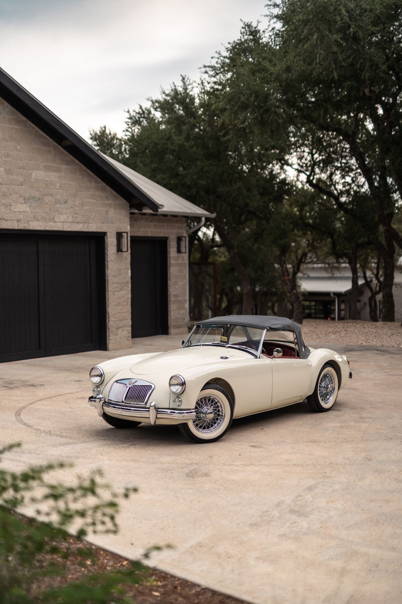 1957 MG MGA Roadster in Old English White with classic wire-spoke rims.