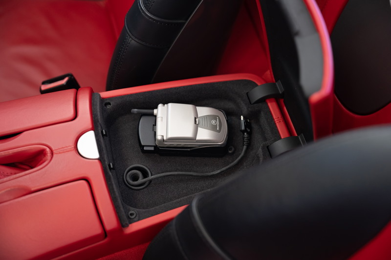 2002 BMW Z8 interior with integrated flip phone in the center console.