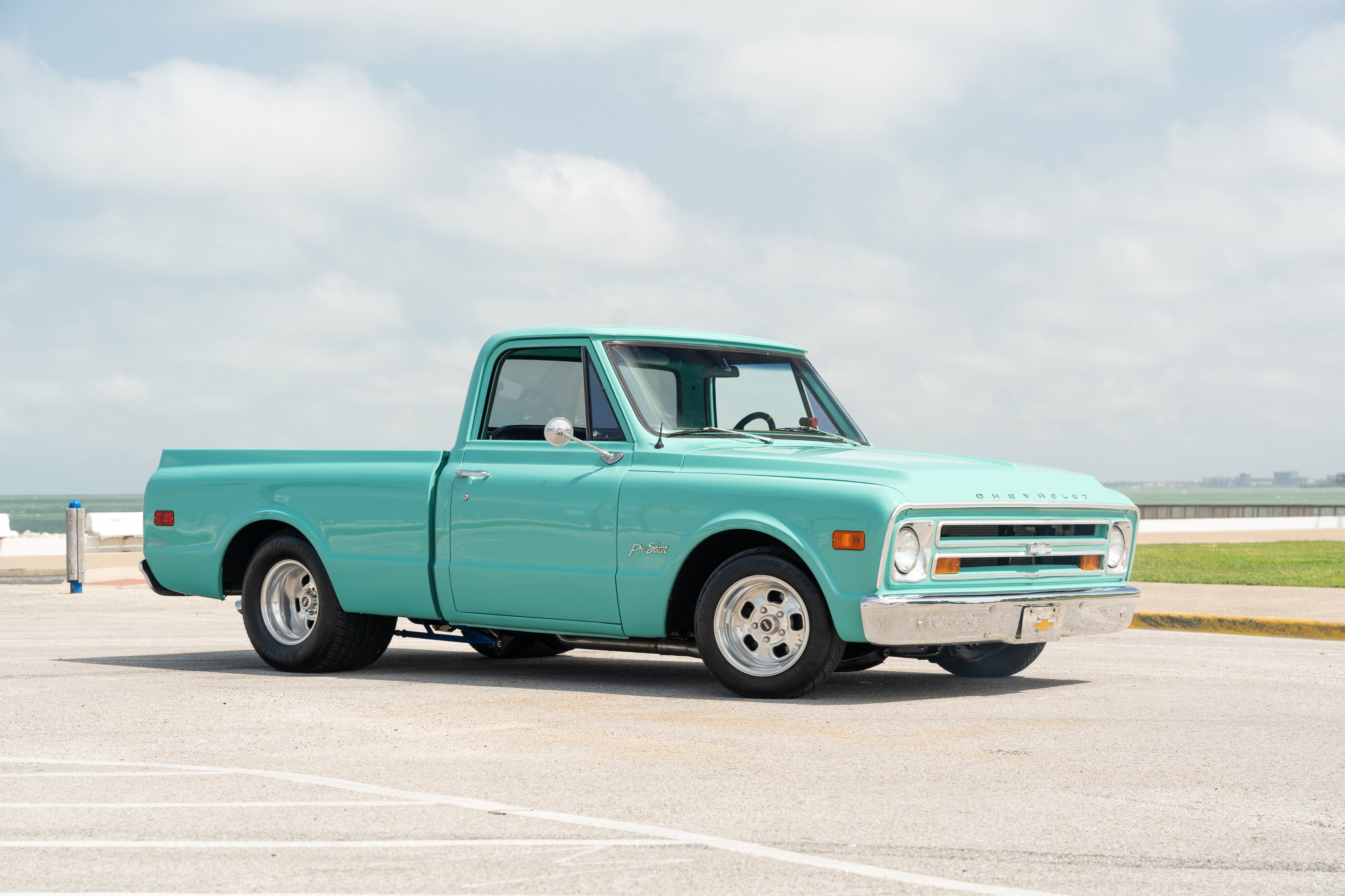 1968 Chevrolet C10 Pro-Street pickup in teal, with chrome bumpers and aluminum rims.