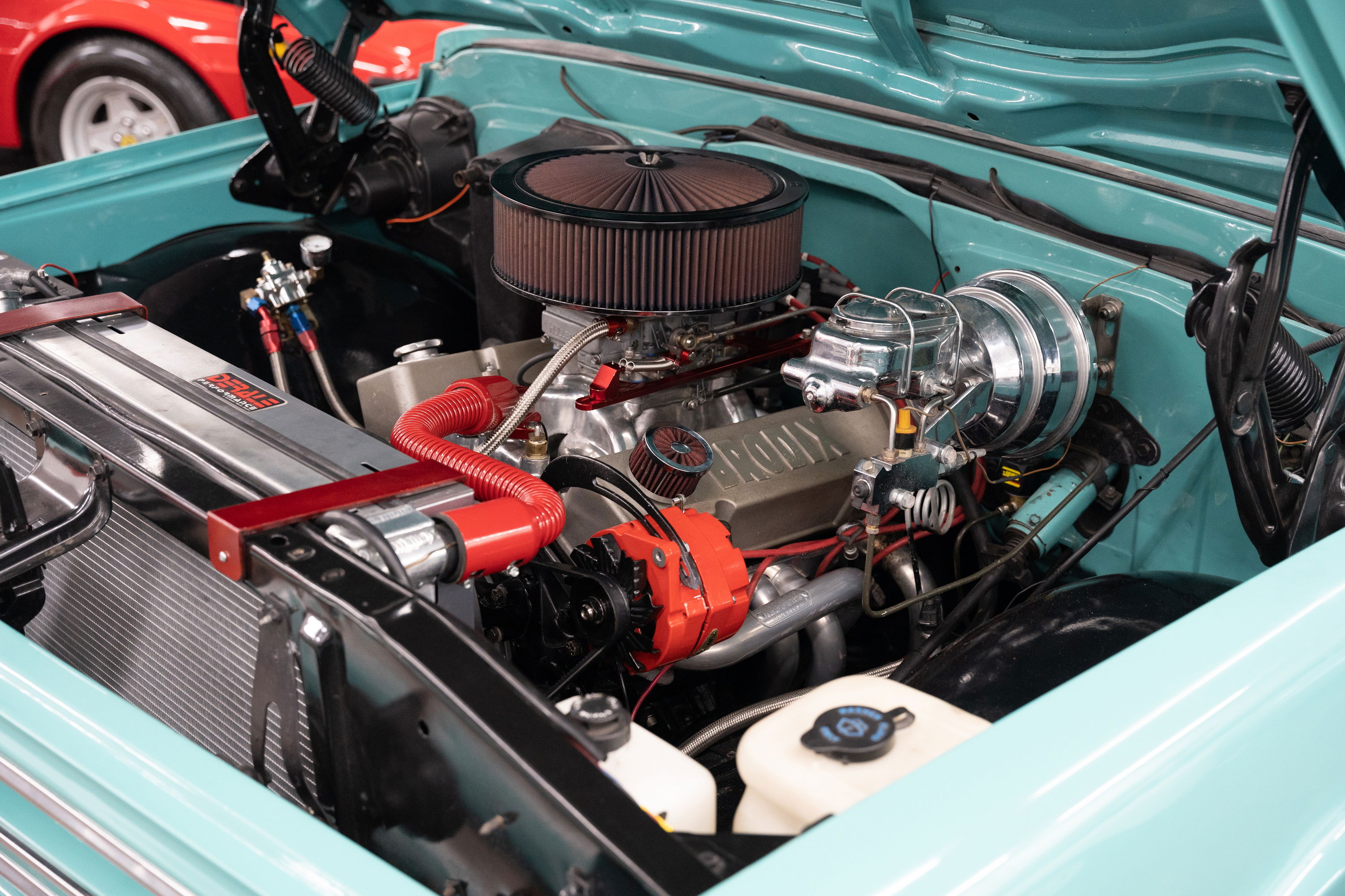 1968 Chevrolet C10 Pro-Street, turquoise, custom V8 engine with chrome brake booster.