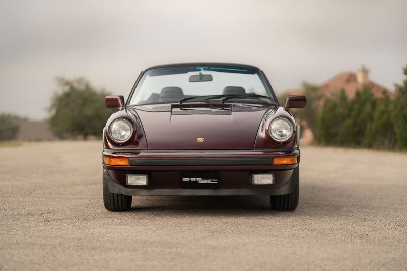 Ruby red metallic 1983 Porsche 911SC Cabriolet front view.