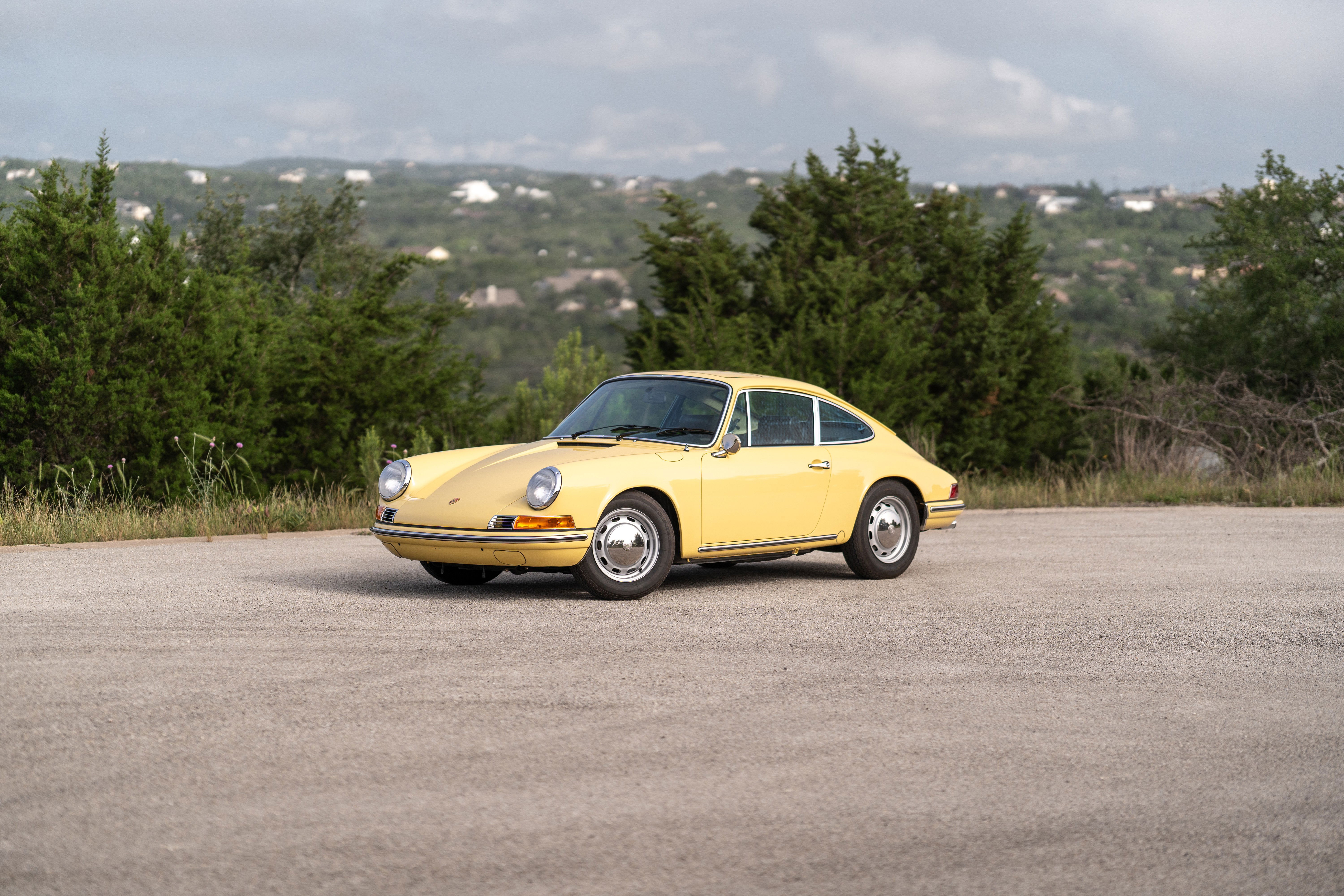 Champagne Yellow 1969 Porsche 912 coupe with chrome trim and polished rims.