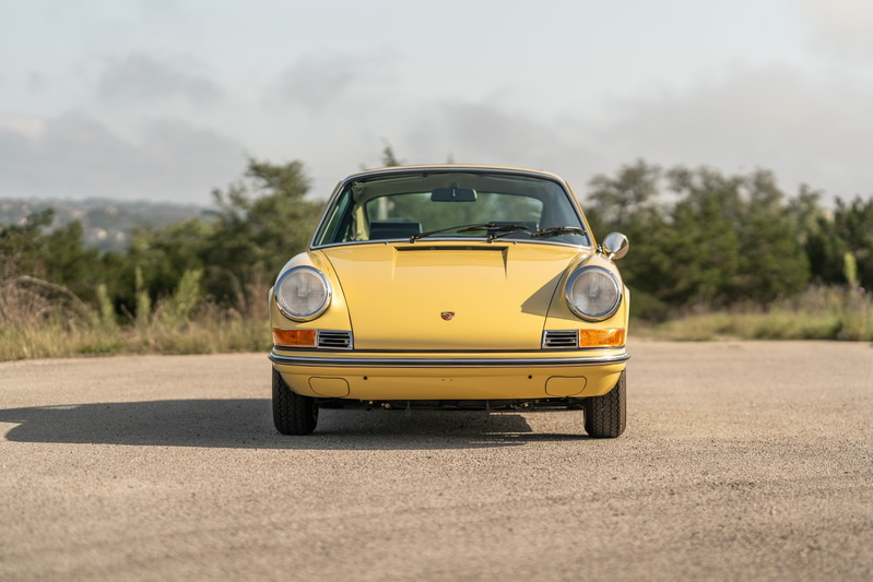 Front view of a yellow 1969 Porsche 912 coupe.
