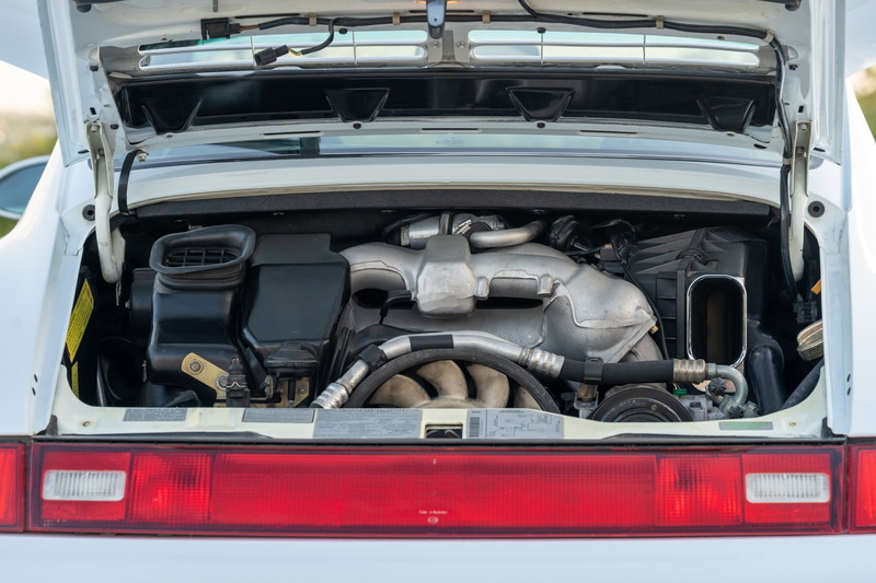 1997 Porsche 993 C4S Glacier White engine bay, twin-turbo boxer engine.