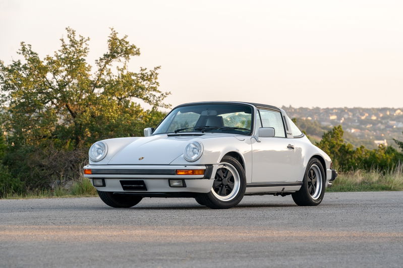 1987 Porsche 911 Carrera Targa in Marble Grey with Fuchs rims and black targa top.