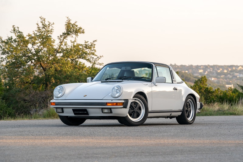 1987 Porsche 911 Carrera Targa in Marble Grey with Fuchs rims and black targa top.