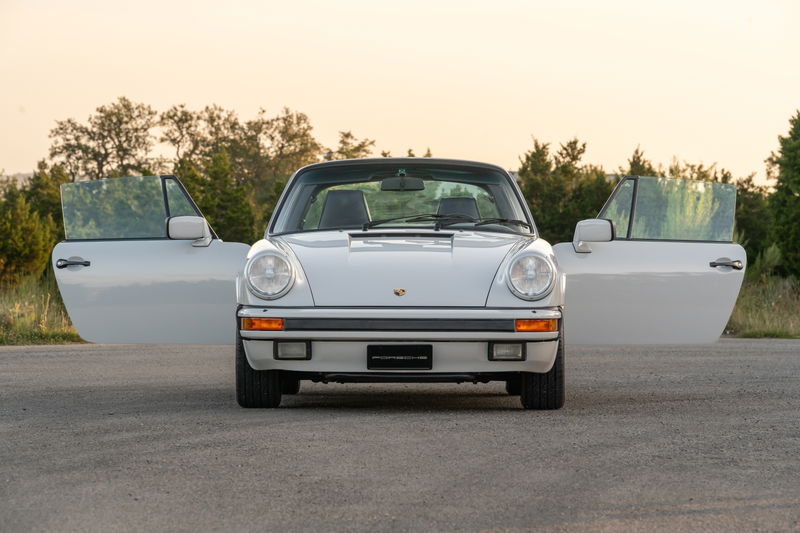 1987 Porsche 911 Carrera Targa in Marble Grey with doors open.