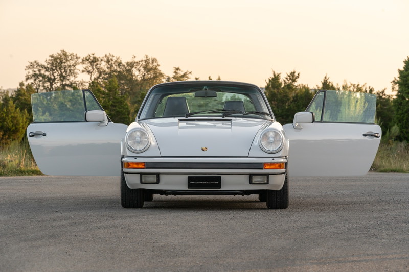 1987 Porsche 911 Carrera Targa in Marble Grey with doors open.