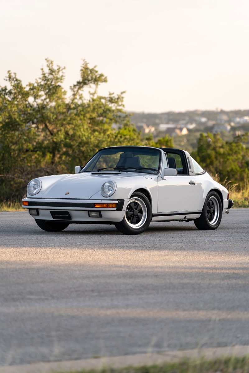 1987 Porsche 911 Carrera Targa in Marble Grey with black trim and Fuchs rims.