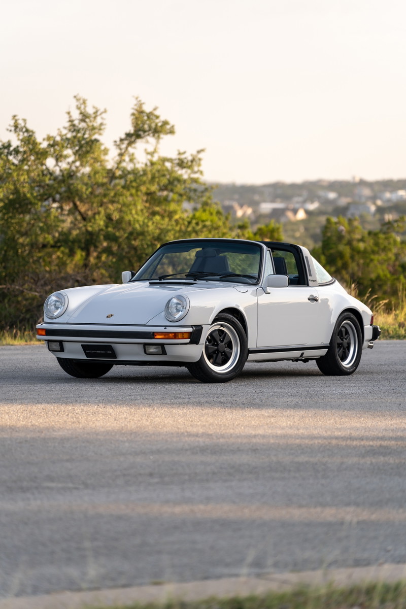 1987 Porsche 911 Carrera Targa in Marble Grey with black trim and Fuchs rims.