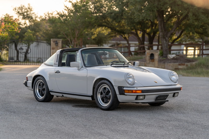 1987 Porsche 911 Carrera Targa in Marble Grey with black trim and Fuchs wheels.