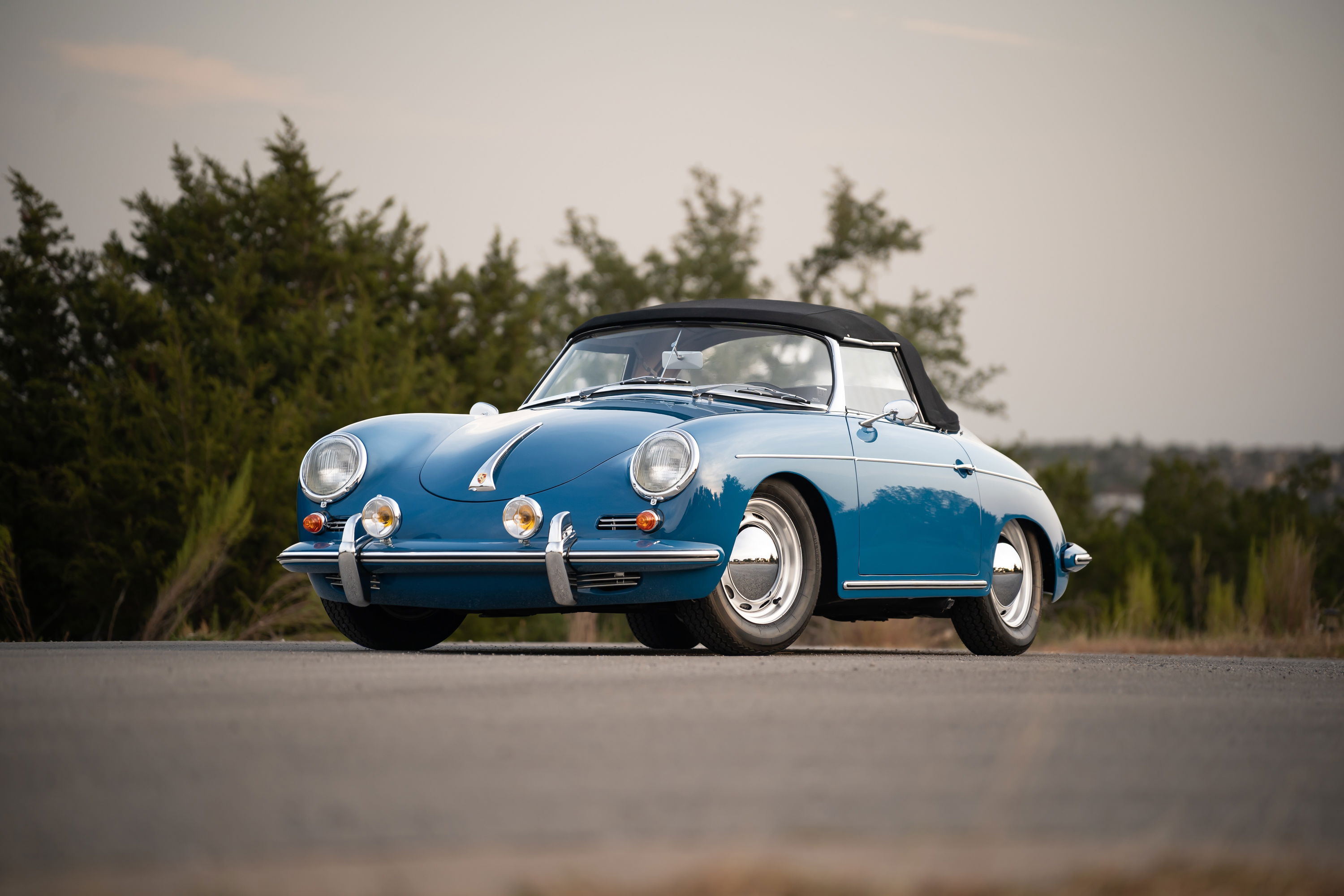1960 Porsche 356B Roadster in Royal Blue with chrome trim and hubcaps.