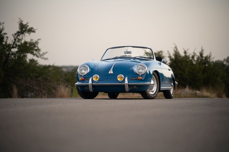 Blue 1960 Porsche 356B Roadster with chrome trim and alloy rims.