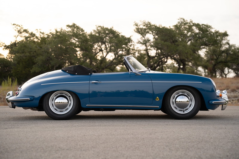 1960 Porsche 356B Roadster in Royal Blue, featuring chrome hubcaps and a black convertible top.