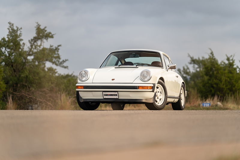 White 1974 Porsche 911 Coupe with classic Fuchs rims.