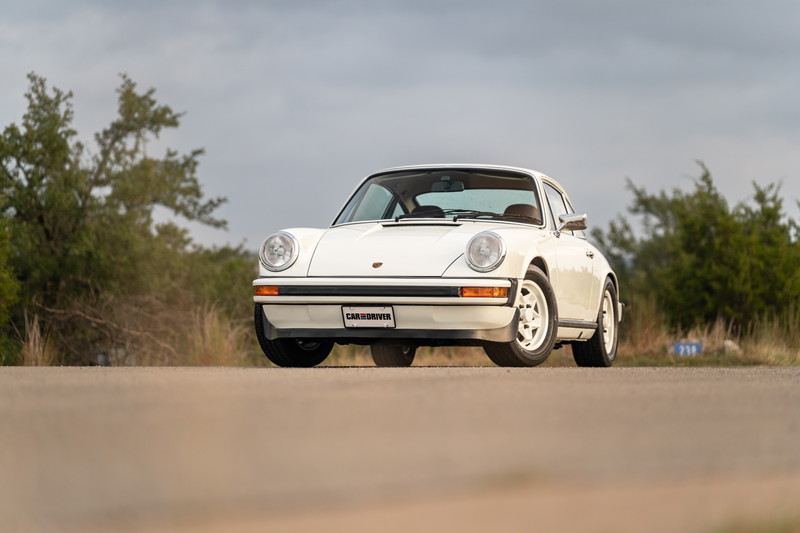 White 1974 Porsche 911 Coupe with classic Fuchs rims.