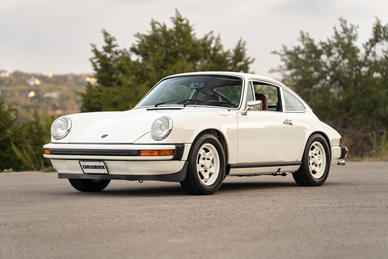 White 1974 Porsche 911 coupe with Fuchs-style rims.