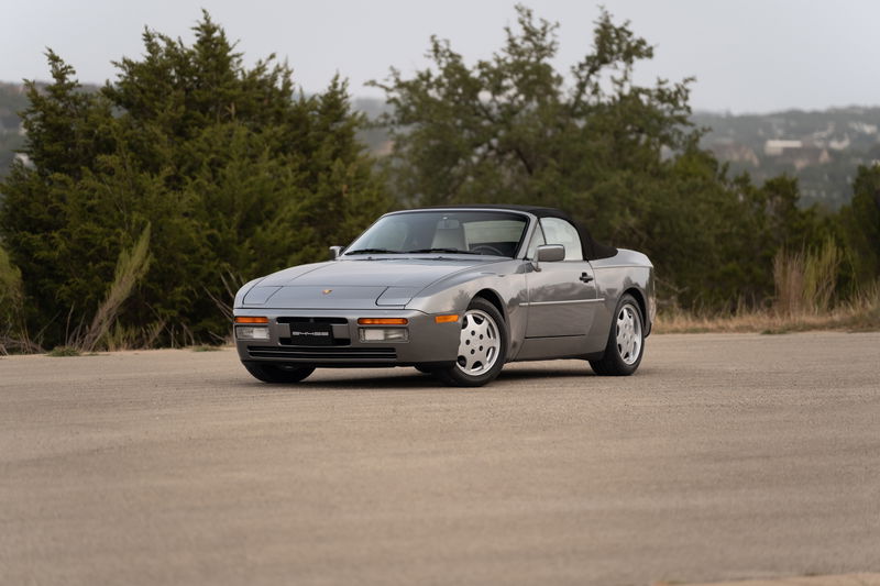 1990 Porsche 944 S2 Cabriolet in Titanium Metallic, featuring Fuchs-style rims.