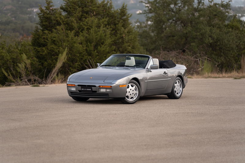1990 Porsche 944 S2 Cabriolet in Titanium Metallic. Features chrome trim and phone dial rims.