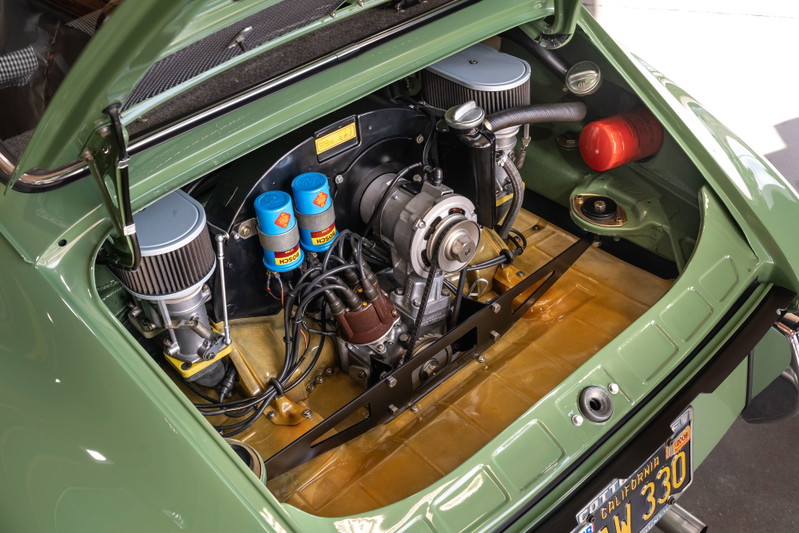 1971 Porsche 911 T engine bay: green paint, twin carburetors, Bosch ignition.