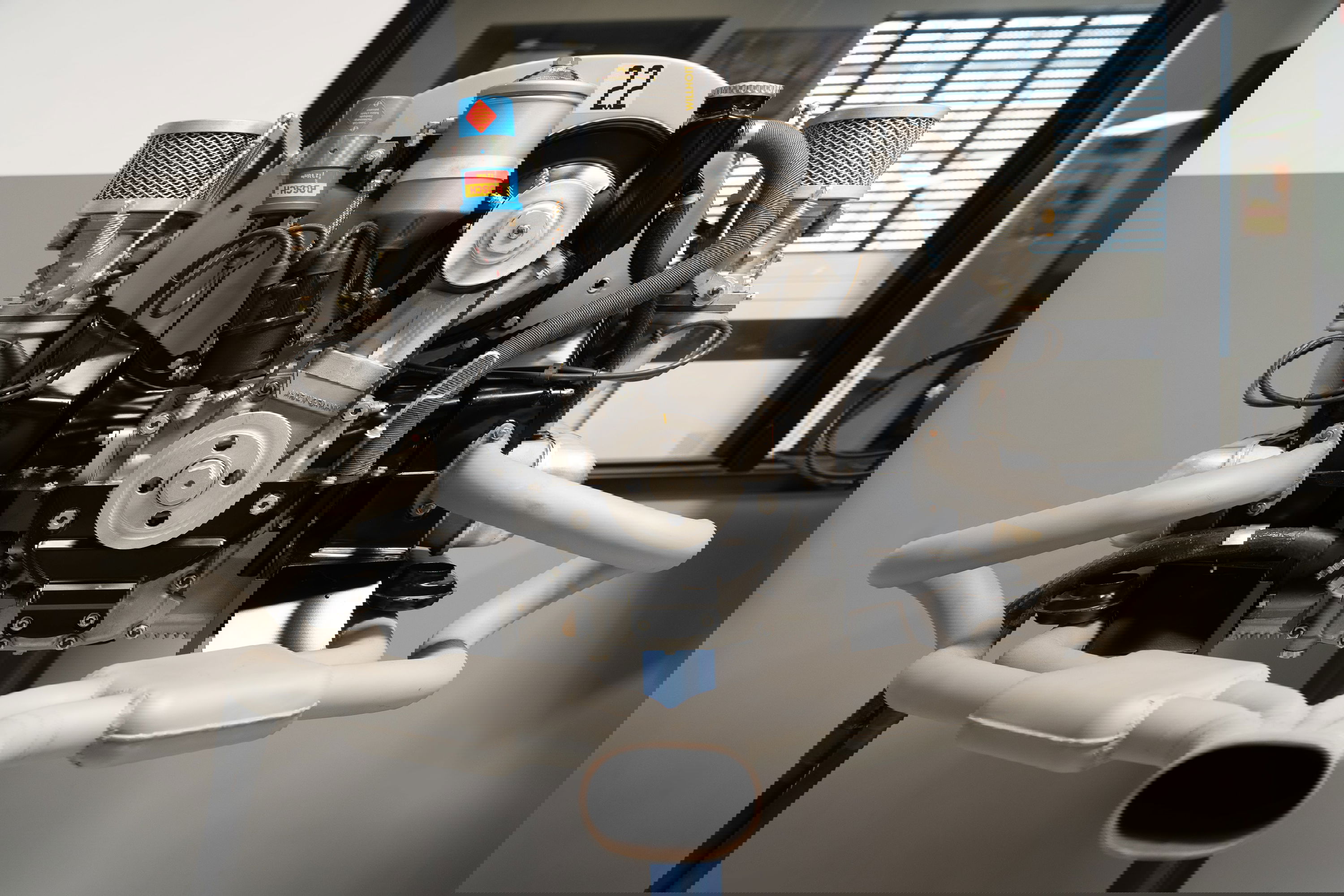 VW Beetle engine with #22 race livery, dual carburetors and custom exhaust.