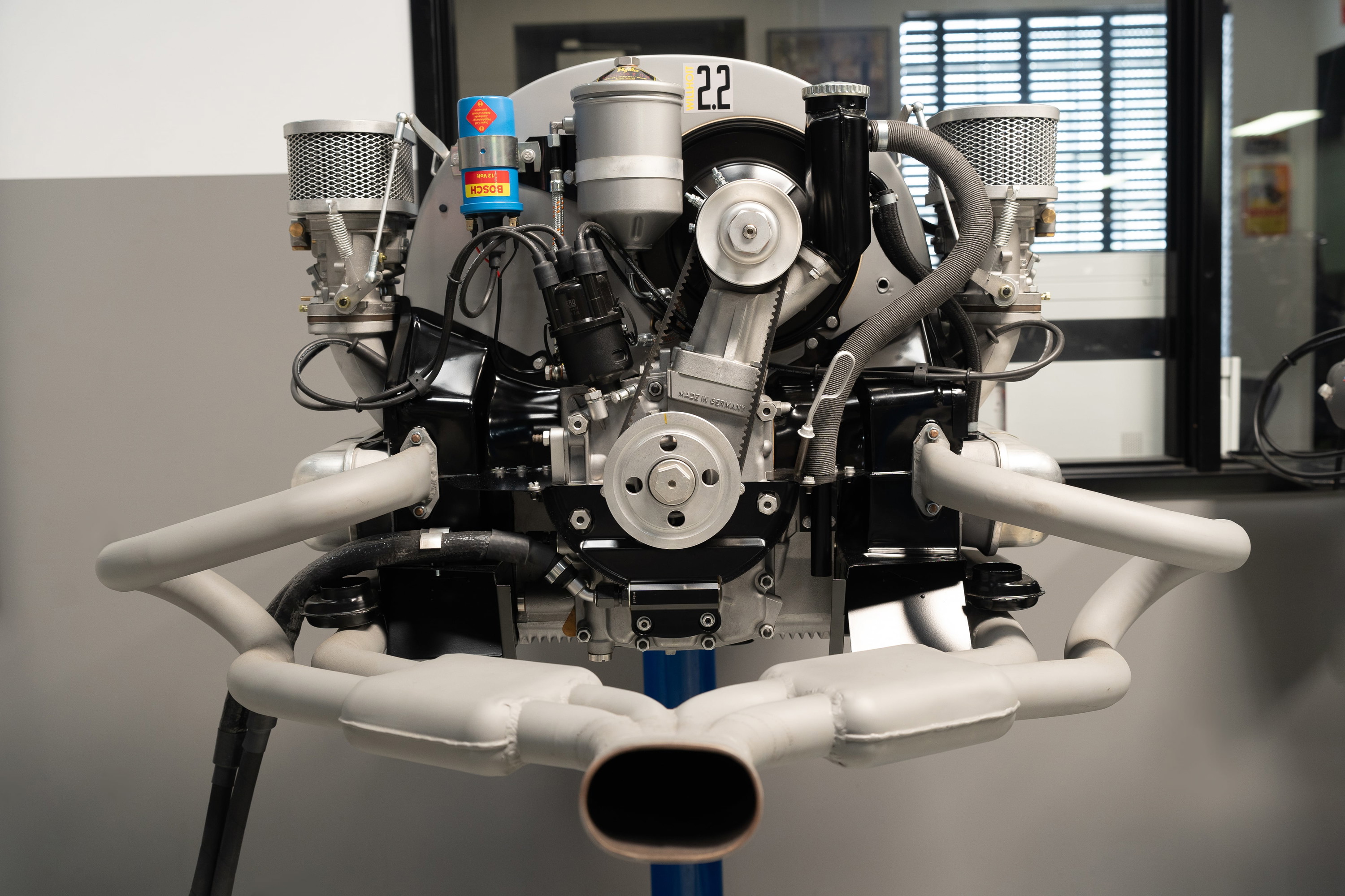 VW Beetle engine with #22 race livery, dual carburetors and custom exhaust.