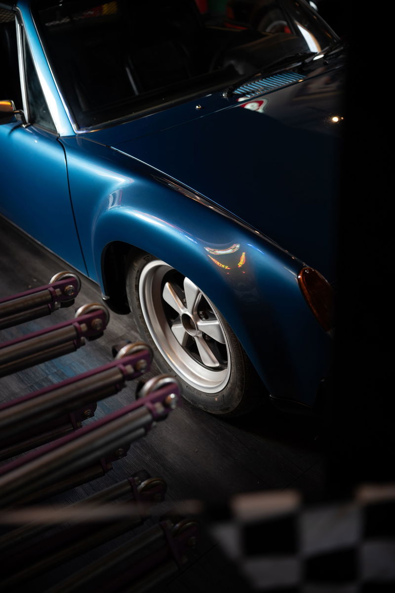 Blue Porsche 914 with Fuchs rims and silver trim.