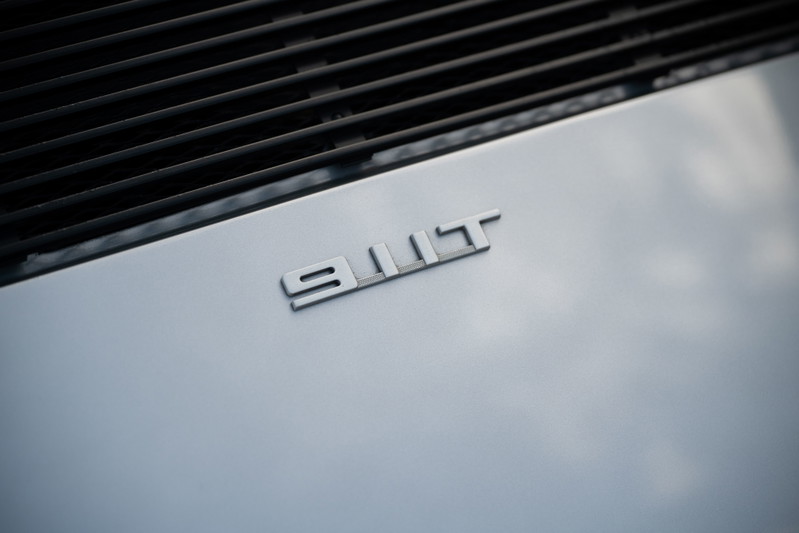 Silver Porsche 911 Turbo emblem on rear decklid.
