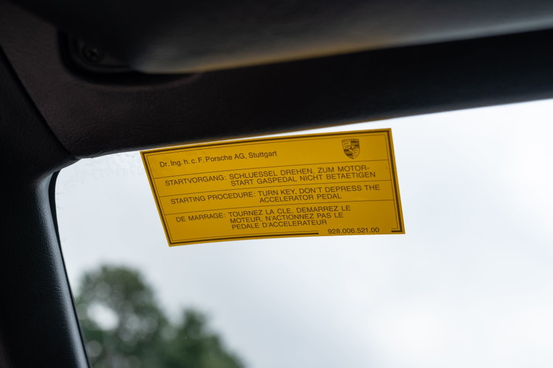 Yellow Porsche 924 Turbo decal on windshield with starting instructions.