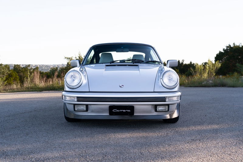 Front view of a silver 1987 Porsche 911 Carrera G50 with 'Carrera' badge.