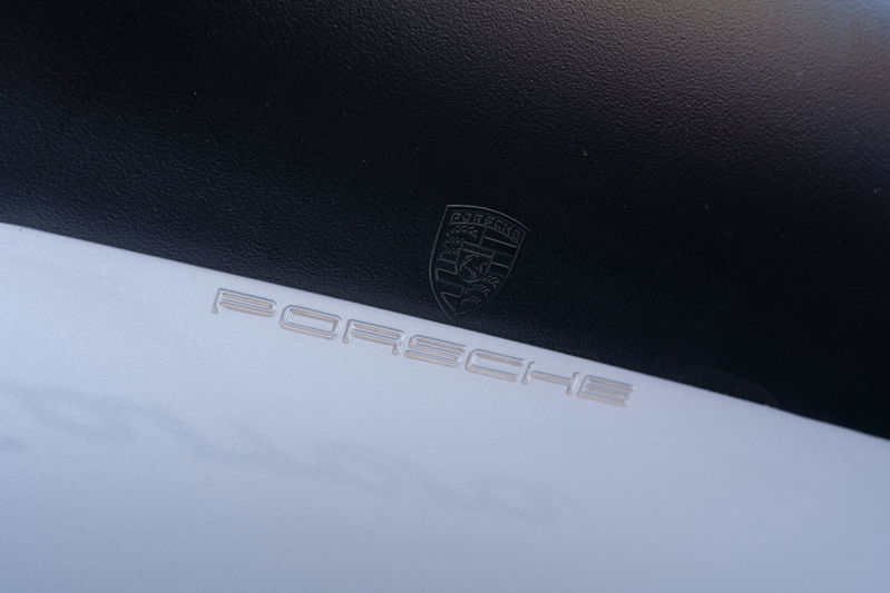 Silver 1987 Porsche 911 Carrera G50 emblem and badging.