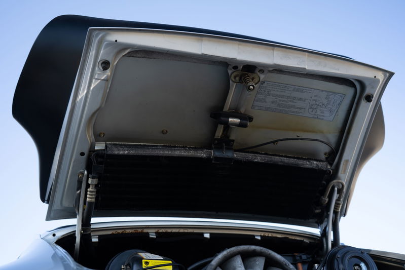 1987 Porsche 911 Carrera G50 in silver metallic, front hood open showing radiator.