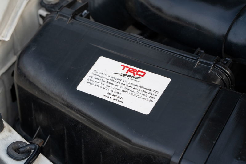 Close-up of the TRD airbox on a white 1994 Toyota Supra.