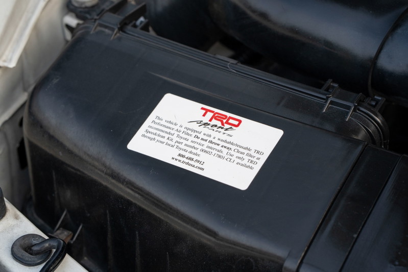 Close-up of the TRD airbox on a white 1994 Toyota Supra.