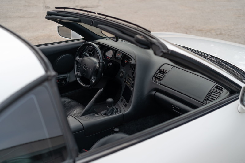 1994 white Toyota Supra interior with black trim and leather seats.