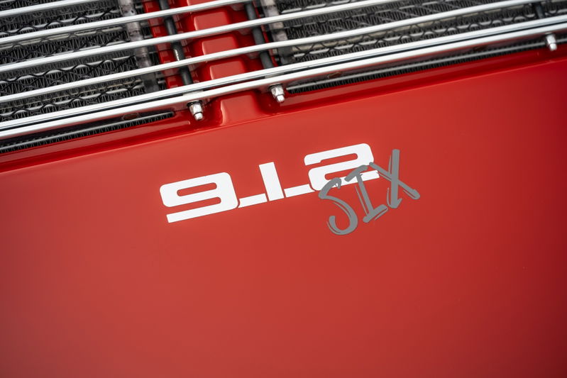 Red 1967 Porsche 912 6-Cylinder coupe with "912 SIX" badging.