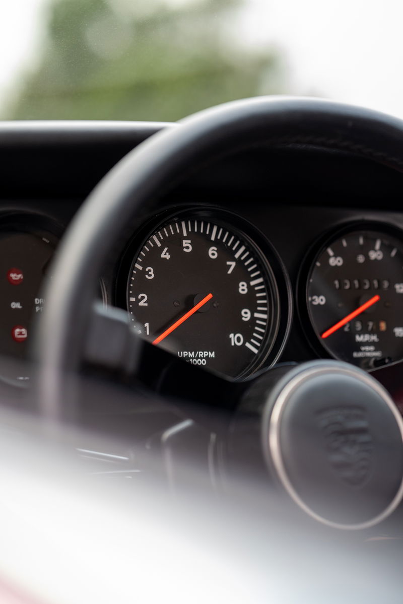 Close-up of the tachometer and speedometer on a 1967 Porsche 912 Coupe dashboard.