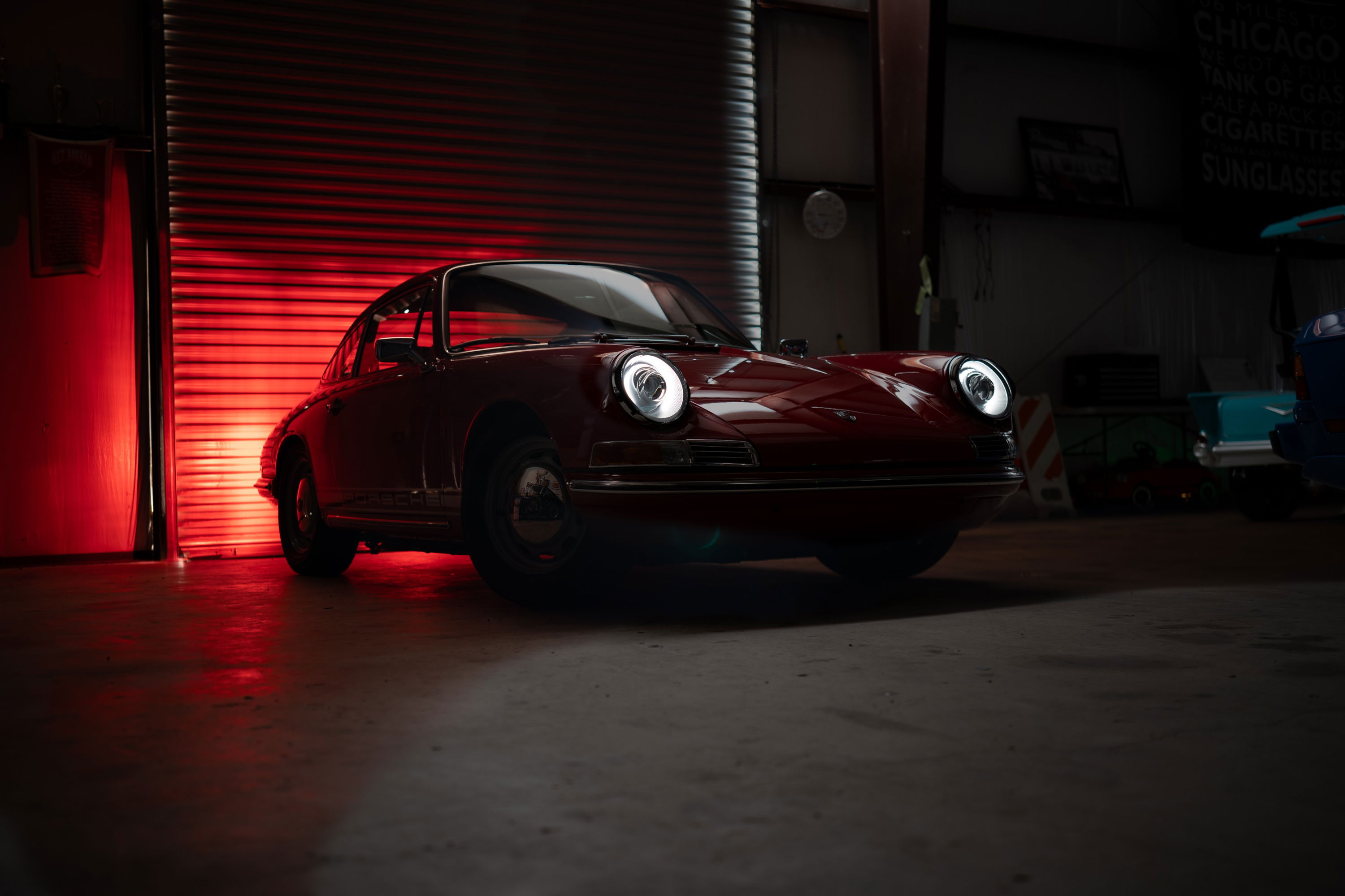 Classic 1967 Porsche 912 Coupe in Polo Red with iconic halo headlights.