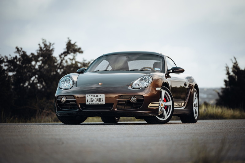 Brown 2008 Porsche Cayman S with silver rims and black trim.