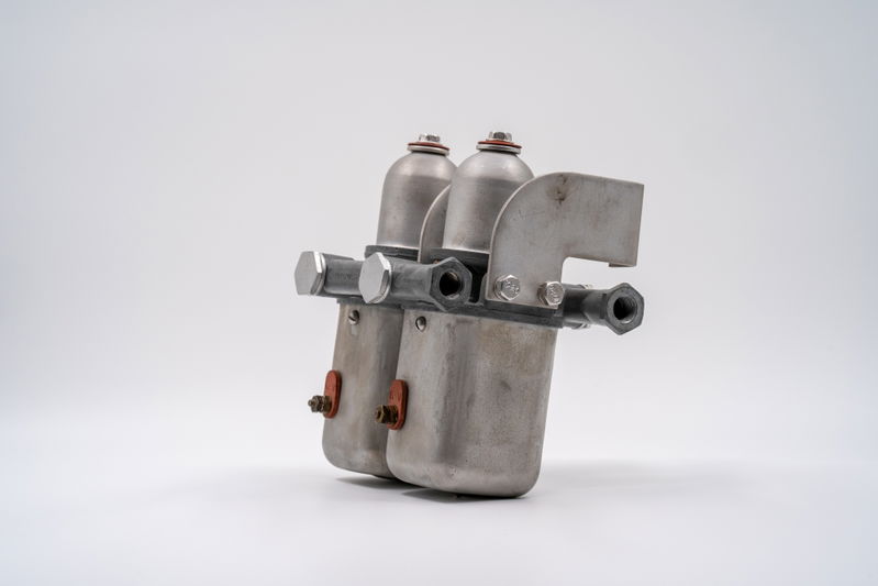 Vintage Porsche 550 Spyder fuel filter assembly, raw metal finish.