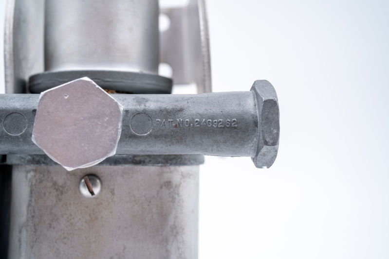 Close-up of a patent-stamped aluminum component on a new 550 Spyder.