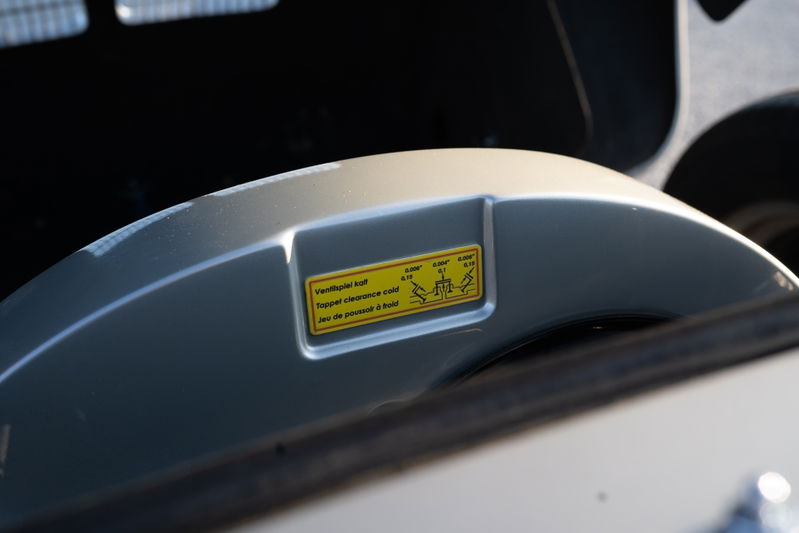 Beck 550 Spyder valve cover with clearance sticker.