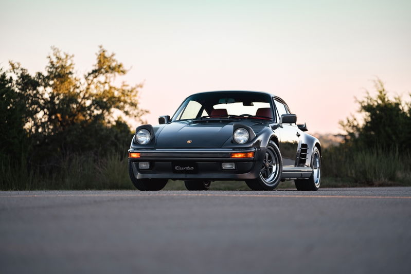Slate grey metallic 1989 Porsche 930 Turbo Flachbau with red interior and Fuchs rims.